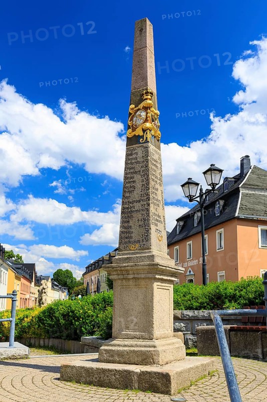 Postal pillar in the market square of Zwönitz, Erzgebirge, Saxony, Germany