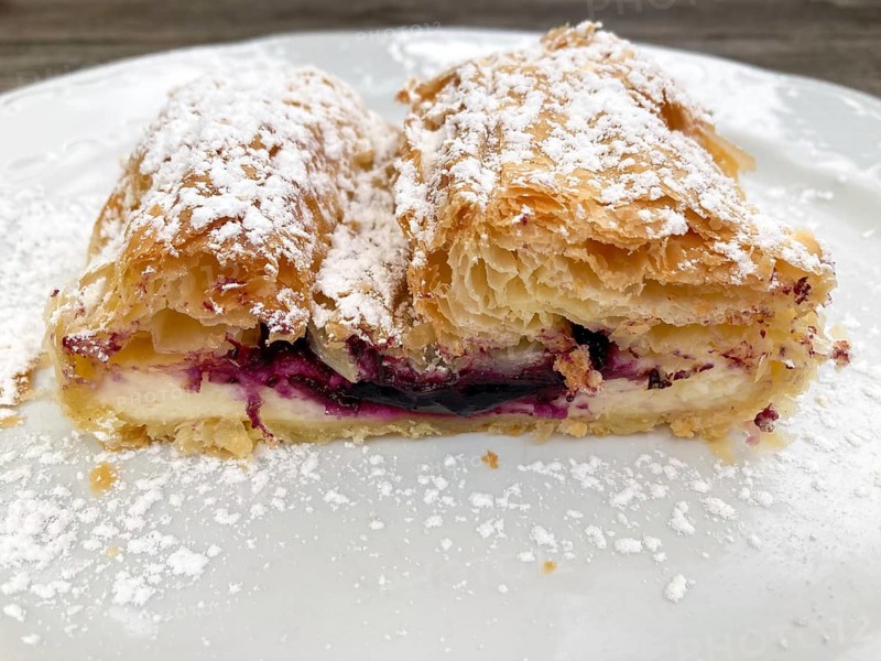 Curd cheese strudel with blueberries, delicious dessert on the mountain pasture, East Tyrol, Austria