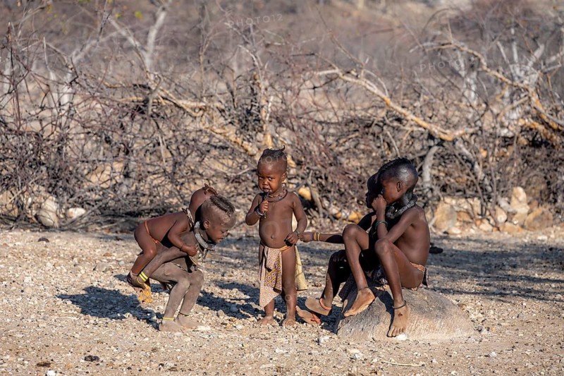 Himba children playing, traditional Himba village, Kaokoveld, Kunene, Namibia