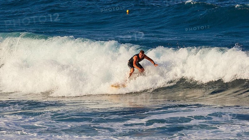 Surfer riding a wave in the sea with energy, wave surfer, surfer, surf, waves, west coast, Arkasa, Karpathos, Dodecanese, Greek Islands, Greece