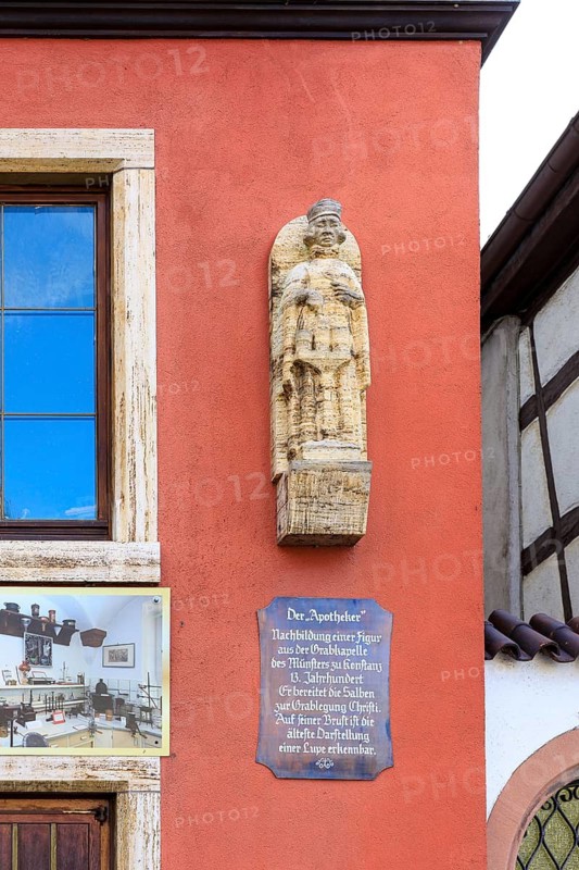 Historical figure of the pharmacist on the facade of the wall of the historic pharmacy on the market square in Schiltach, Black Forest, Baden-Württemberg, Germany
