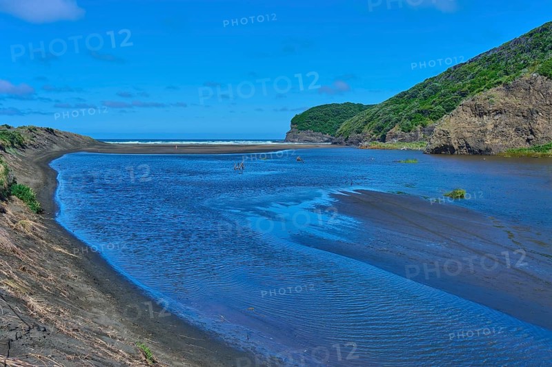 River landscape with hills and a clear sky, Bethells Beach, Te Henga, Auckland, New Zealand