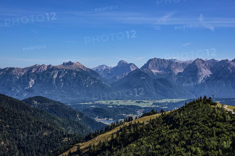 View from the summit of the Wank (1780 m) near Garmisch-Partenkirchen in the direction of the JKarwendel Mountains, in the centre in the foreground the Geroldsee in Werdenfelser Land, Bavaria, Germany
