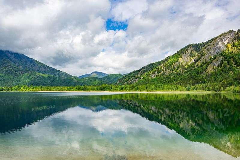 Landscape of Lake Offensee after rain when the sun comes through the clouds in spring, Salzkammergut, Austria