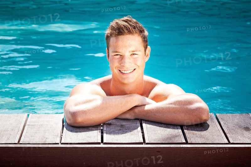 A friendly young man relaxing in the swimming pool, 30, years, swimming pool