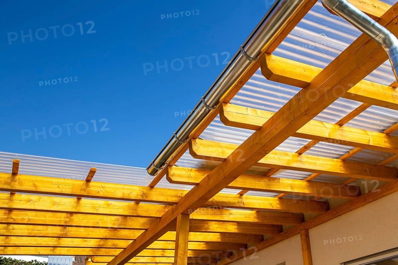New patio roofing with wood and corrugated acrylic glass panels