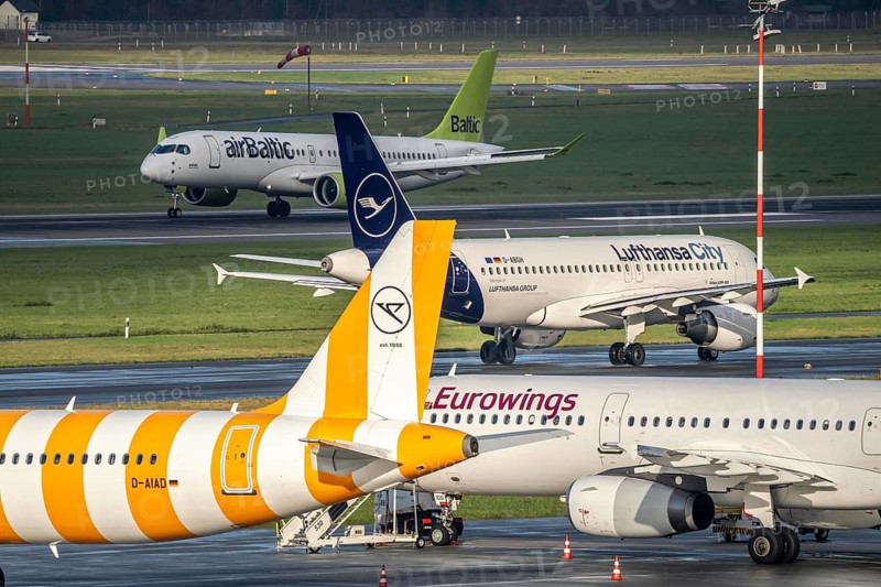 Düsseldorf Airport, Eurowings, Condor aircraft on the apron, Air Baltic Airbus on take-off, Lufthansa City Airbus A319 on the taxiway for take-off, Düsseldorf, North Rhine-Westphalia, Germany