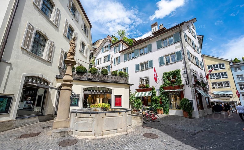 Fountain of the Amazons, Rennweg with historic houses in the old town, Zurich, Switzerland