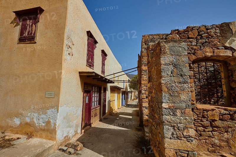 A building with ancient architecture and colourful shutters, illuminated by daylight, Venetian Sea Fortress, Leper Island, Spinalonga, Elounda Bay, Mirabello Bay, East Crete, Crete, Greek Islands, Greece