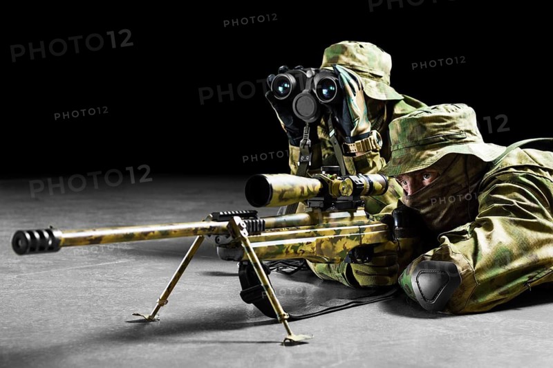 Sniper together with the gunner took the position and expect the target.