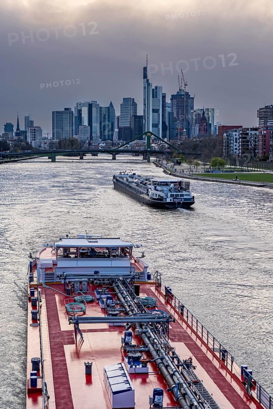 Skyline of Frankfurt am Main, skyscrapers, business and banking district in the city centre, cargo ships, tankers, on the Main, Hesse, Germany