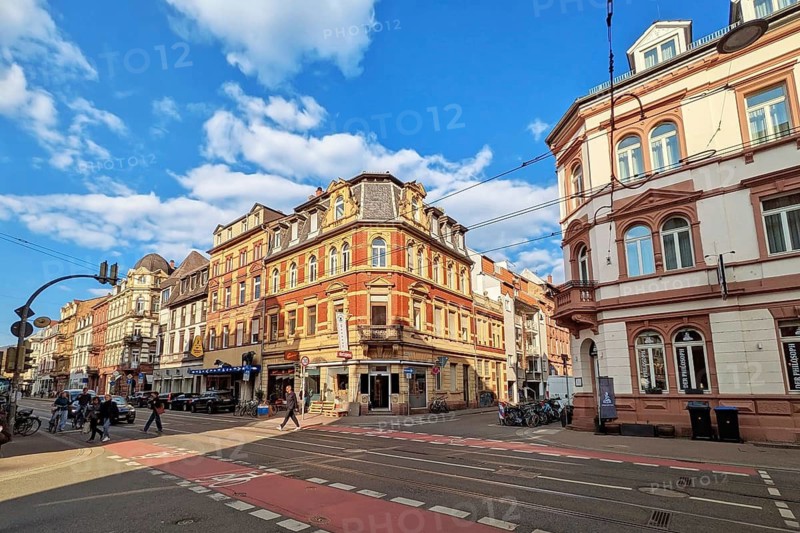 Heidelberg, Germany - 19 March 2026: Historic corner building at Brückenstraße 16 in Heidelberg illuminated by warm evening sun
