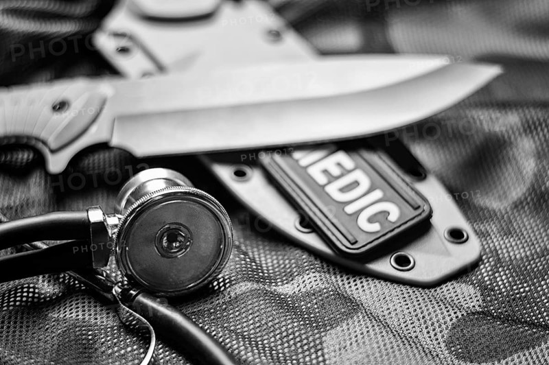 Stethoscope lies on the uniform of a US soldier. The concept of health care, military insurance, state care. Top view.