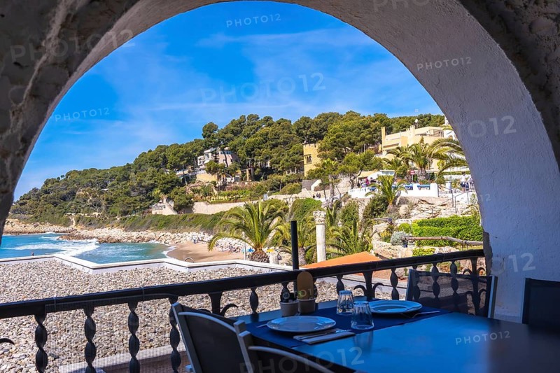 Restaurant terrace overlooking the mediterranean sea near roc de sant gaieta in comarruga, tarragona, spain
