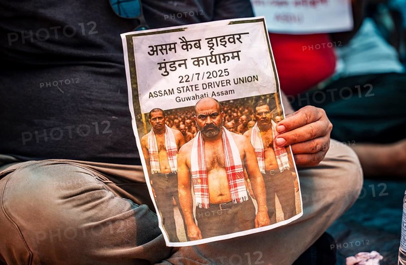 Drivers affiliated with Ola, Uber, and Rapido, under the banner of the Assam State Drivers' Union and the All Assam Cab Welfare Federation, shaved their heads in protest in Guwahati, India, on July 22, 2025. The demonstration held to highlight their demands for fair fare rates, regulation of aggregator commissions, and access to social security and welfare benefits