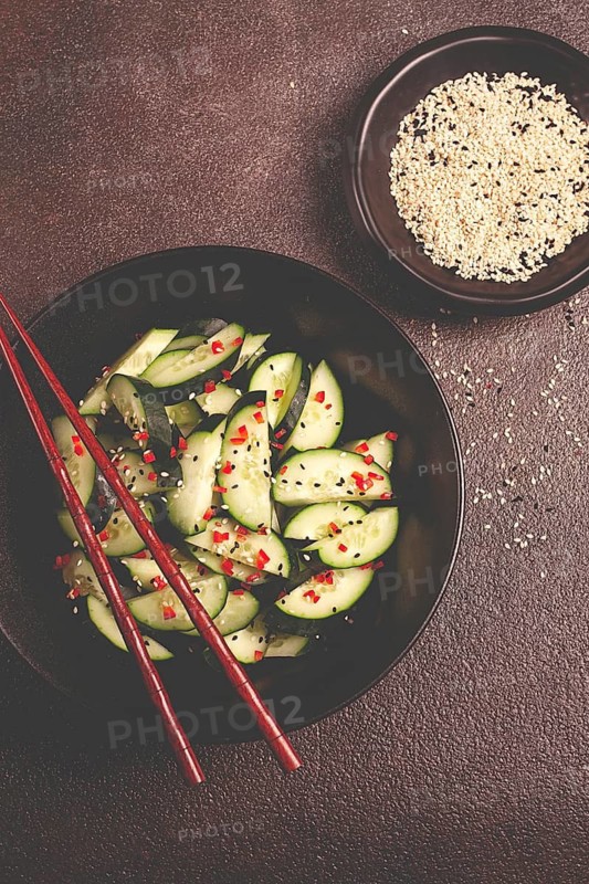 Chinese salad, cucumbers with chili pepper and sesame seeds, homemade, no people