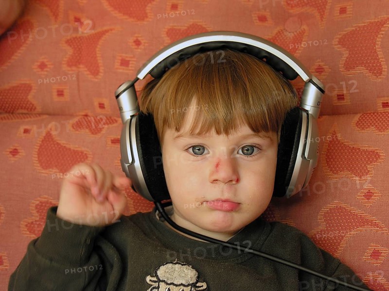 Portrait of a little boy, 3 years old with headphones, Franconia, Bavaria, Germany