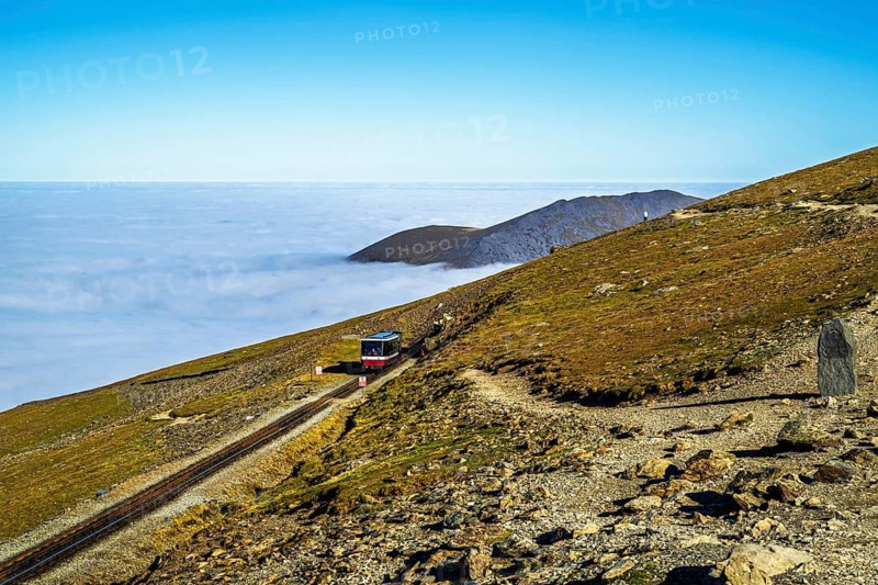 Train on Snowdon Massif, Snowdon Range, Snowdonia, North Wales, UK