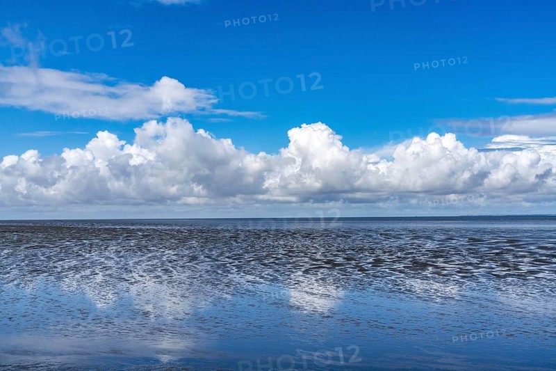 Wadden Sea between the Dutch coast near Eemshaven and the German North Sea island of Borkum, Wadden Sea National Park, UNESCO World Heritage Site, low tide, low water, clouds