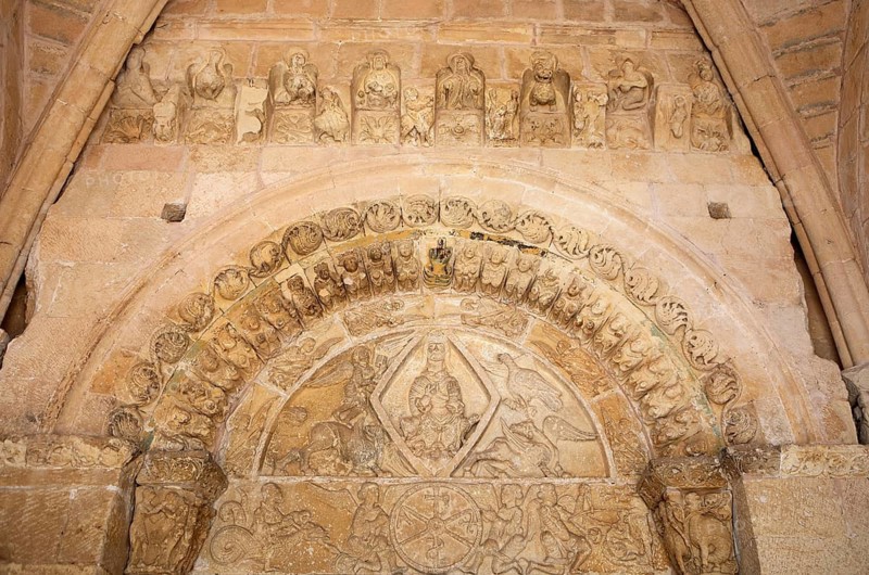 Figures on the Romanesque portal of the Virgen de la Pena church in the historic centre of Sepulveda, province of Segovia, Castile and Leon, Spain