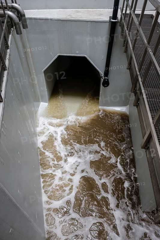 Oberhausen, Ruhr area, North Rhine-Westphalia, Germany - Emscher conversion, new Emscher AKE sewer, here the inlet channel from the Oberhausen pumping station, test run, the pumping station is being flooded on a trial basis, the pumps are also being tested, which will pump 16, 000 litres of wastewater per minute in future, the ecological conversion of the Emscher system consists of the construction of a central wastewater treatment system in the Ruhr area, the construction of sewers and the renaturation of the Emscher and its tributaries