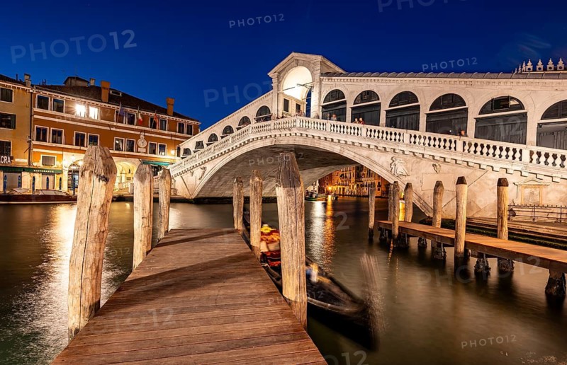Rialto Bridge and gondolas on the Grand Canal, blue hour, long exposure, Venice, Veneto, Italy