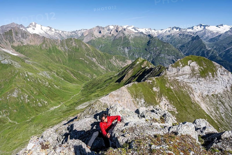 Mountaineer climbing in front of mountain panorama with Großvenediger, mountain landscape with mountain peaks of the Venediger group, view from the summit of the Gösleswand, Lasörling group, Hohe Tauern National Park, East Tyrol, Tyrol, Austria