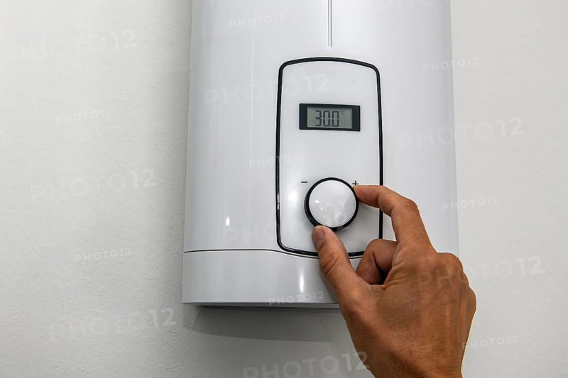 Instantaneous water heater for hot water Shower for showering Washbasin Bidet is set to low-energy level 30 degrees Celsius for saving energy Electricity energy saving Electricity saving, Germany