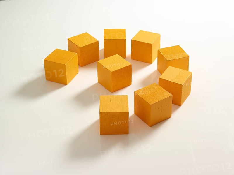9 yellow wooden cubes against a white background