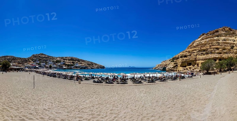 Matala beach with a view of the rock caves, south coast, Crete, Greece