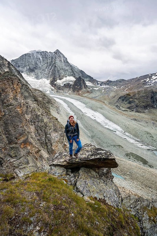 Mountaineer at Col de Riedmatten, view of glacier Glacier de Cheilon and mountain peak Mont Blanc de Cheilon, Valais, Western Alps Switzerland