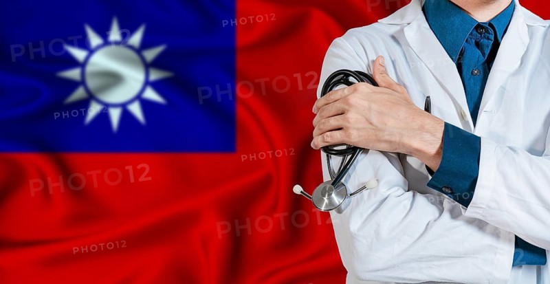 Doctor With Stethoscope On Taiwan Flag. Doctor Holding Stethoscope On Taiwan Flag