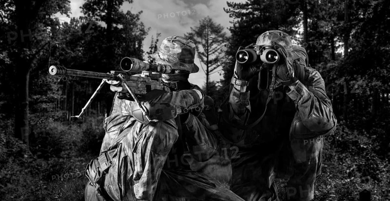 Group of snipers with a night vision device tracks the target.