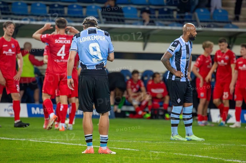 Football 3rd division, season 2024/25, matchday 32: Waldhof Mannheim vs SpVgg Unterhaching***Felix Lohkemper and Terrence Boyd (Mannheim) frustrated after the final whistle, the Unterhaching players cheer