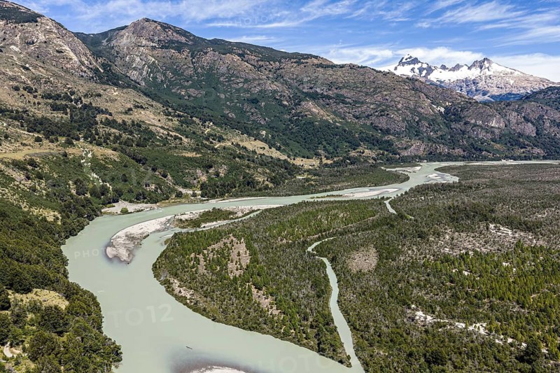 River rio delta o el leon, mountain range of Valle Exploradores in the back, aerial view, Patagonia, Chile