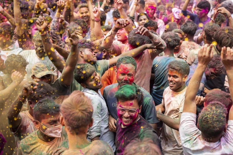 Revellers dancing in the beat of music as they celebrate Holi on a street, the Hindu spring festival of colours on March 25, 2024 in Guwahati, Assam, India. Holi, also known as the Festival of Colors or the Festival of Spring, is one of the most vibrant and joyous festivals in India