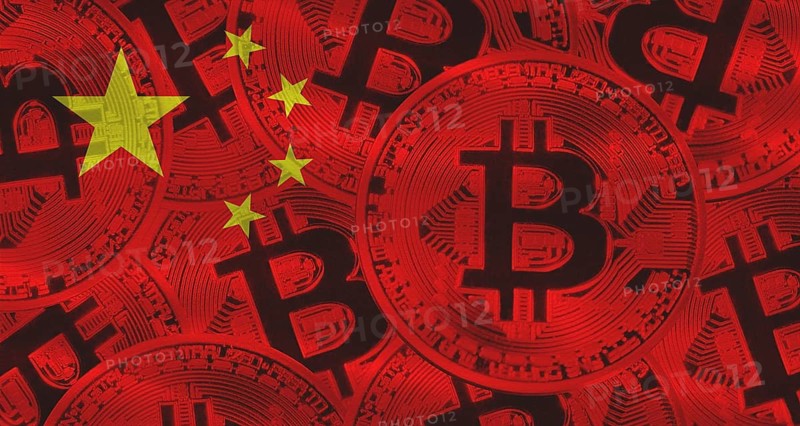 Bitcoins on China flag background. Golden bitcoin coins on China flag background