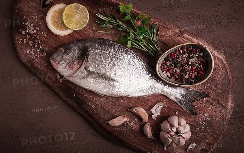 Fresh, raw dorado fish, top view, no people