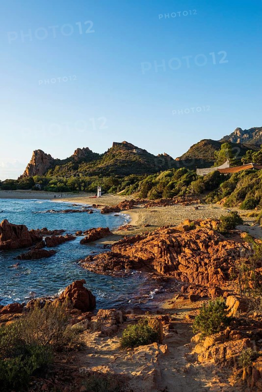 Lonely picturesque beach and red rocks, Spiaggia Su Sirboni, sunrise, near Tertenia, Province of Ogliastra, Sardinia, Italy