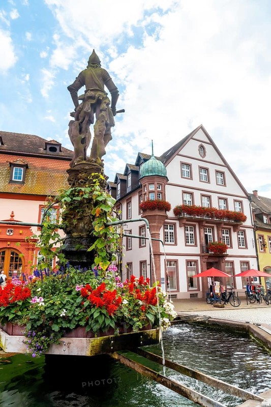 Marktplatz Brunnen water fountain in the medieval village Gengenbach in the Black Forest, Germany