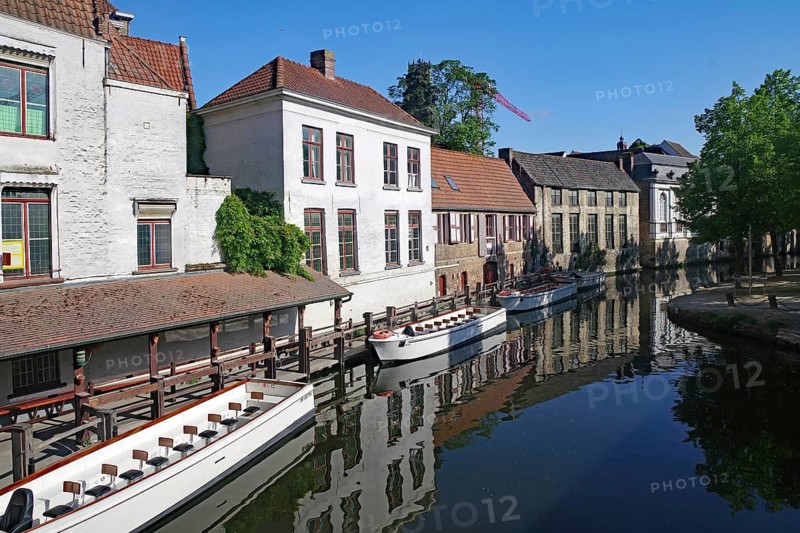 Idyllic canal with boats flanked by historic buildings, canals, Bruges, West Flanders, Belgium