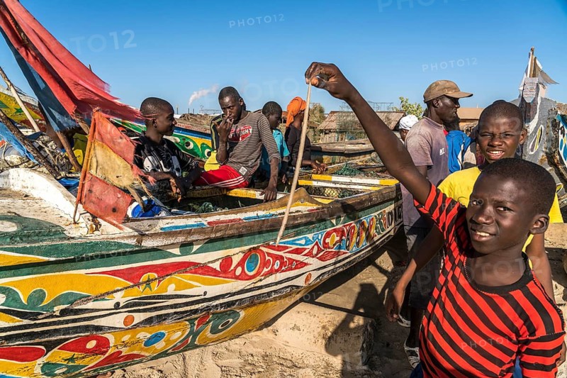 Fishermen with their catch on Sanyang beach, Gambia, West Africa