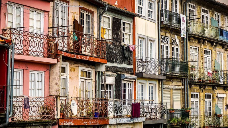 Beautifully decorated balconies on colorful, historic old town buildings, Porto, Portugal