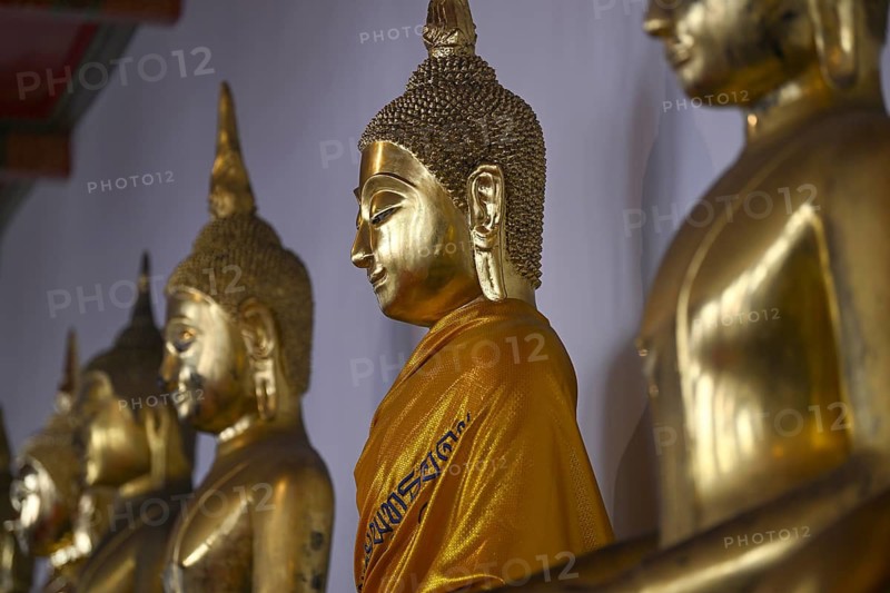 Gilded Buddha statues in Wat Pho, Temple of the Reclining Buddha, Bangkok, Thailand