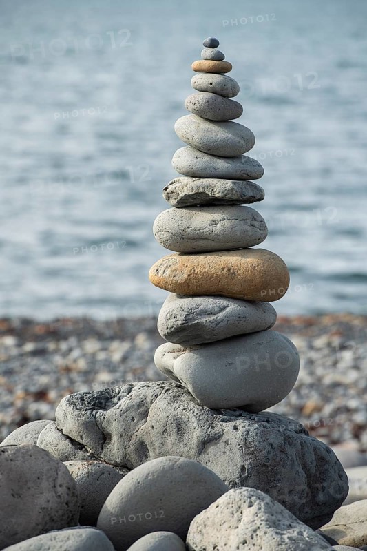 Concept of balance and harmony, pile of stones, beach, sea, Iceland