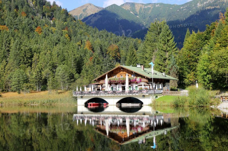 The picturesque Pflegersee lake near Garmisch, with the mountain inn in the background