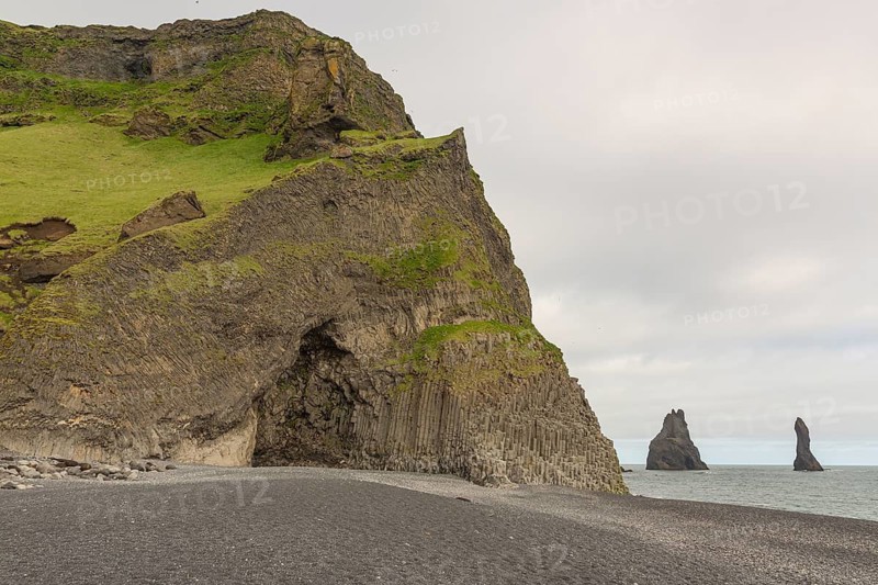 Reynisfjara Beach with Basalt rocks (Stuolabrrg) and the rock needles (Haidrangur), close to Vik i Myrdal, South Iceland