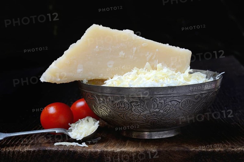 Parmesan cheese, grated cheese in rind and piece of Parmesan, Italy