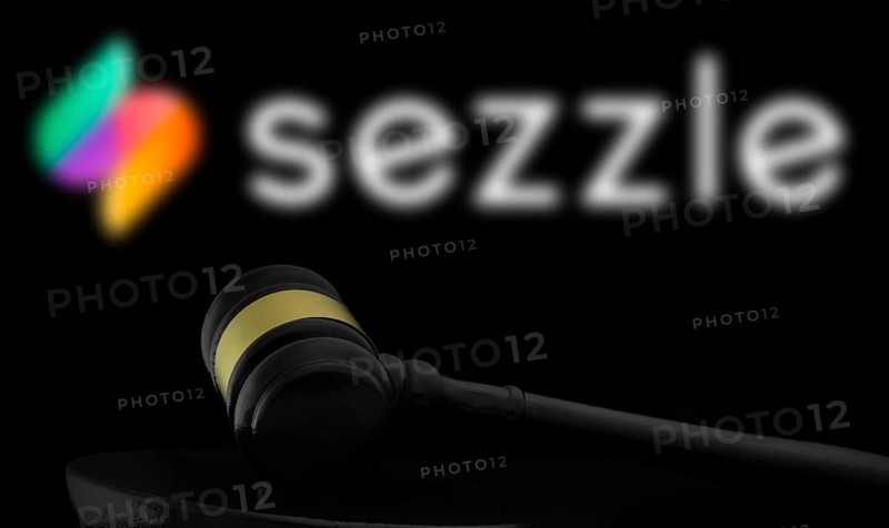 Court gavel in front of the Sezzle logo.
