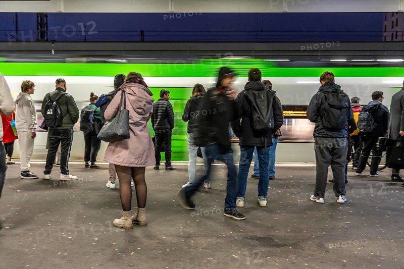 Passengers waiting for a regional train on platform 7, Essen Central Station, North Rhine-Westphalia, Germany